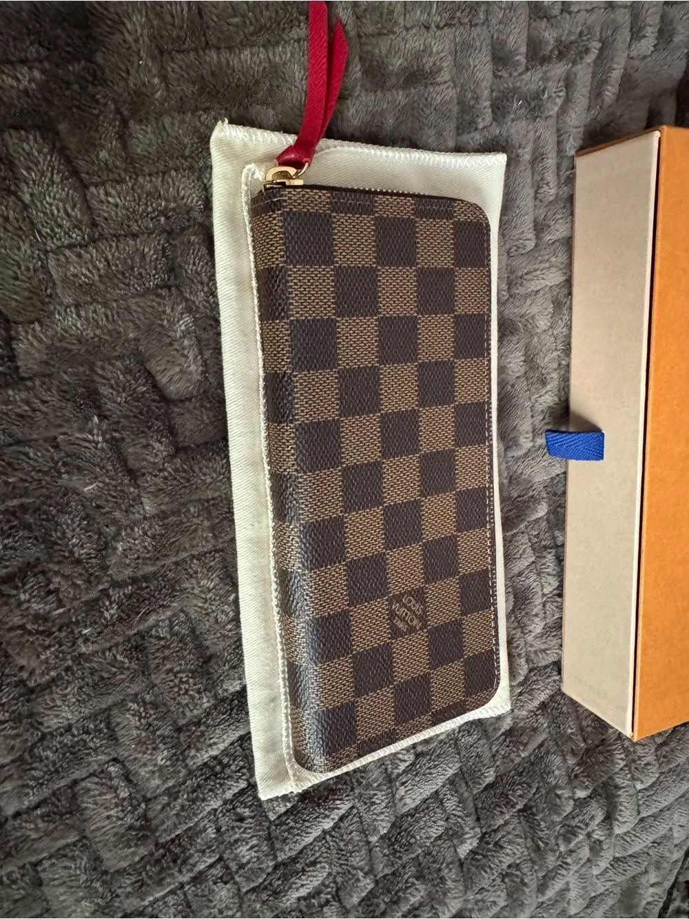 Louis Vuitton Damier Ebene Zippy Wallet in Brown with Red Pull-Tab